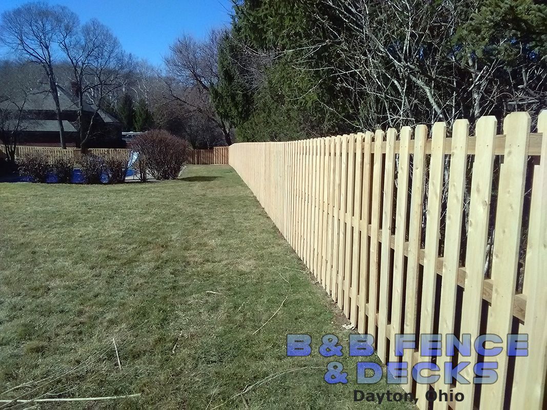 Wooden Picket and Grass Field — Dayton, OH — B & B Fence & Decks LLC