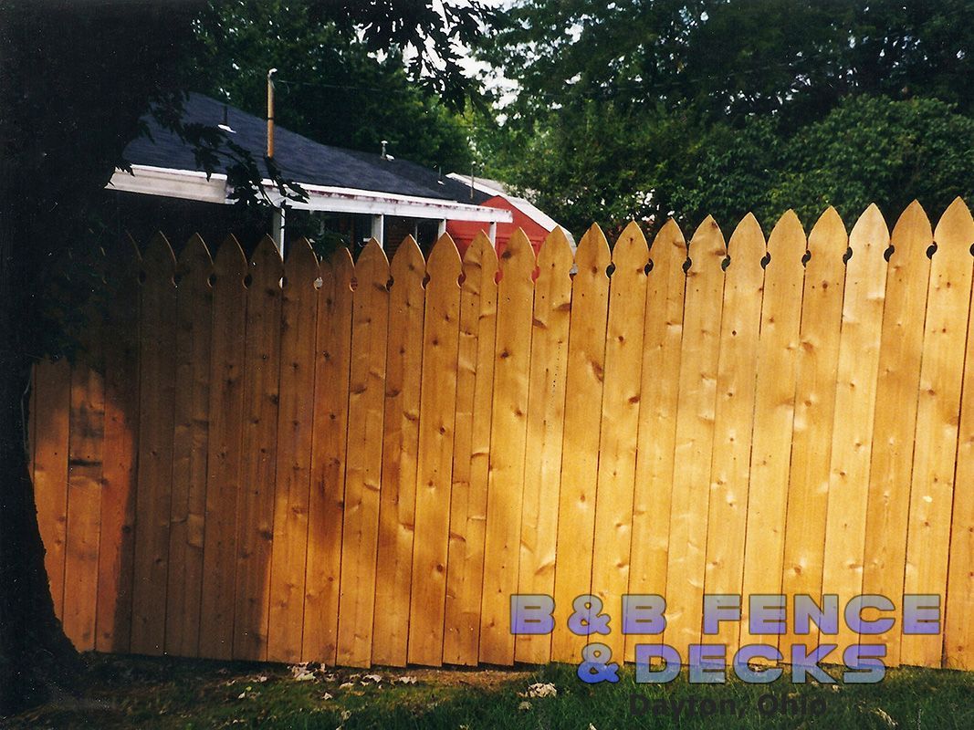Wooden Picket Fence and Trees — Dayton, OH — B & B Fence & Decks LLC