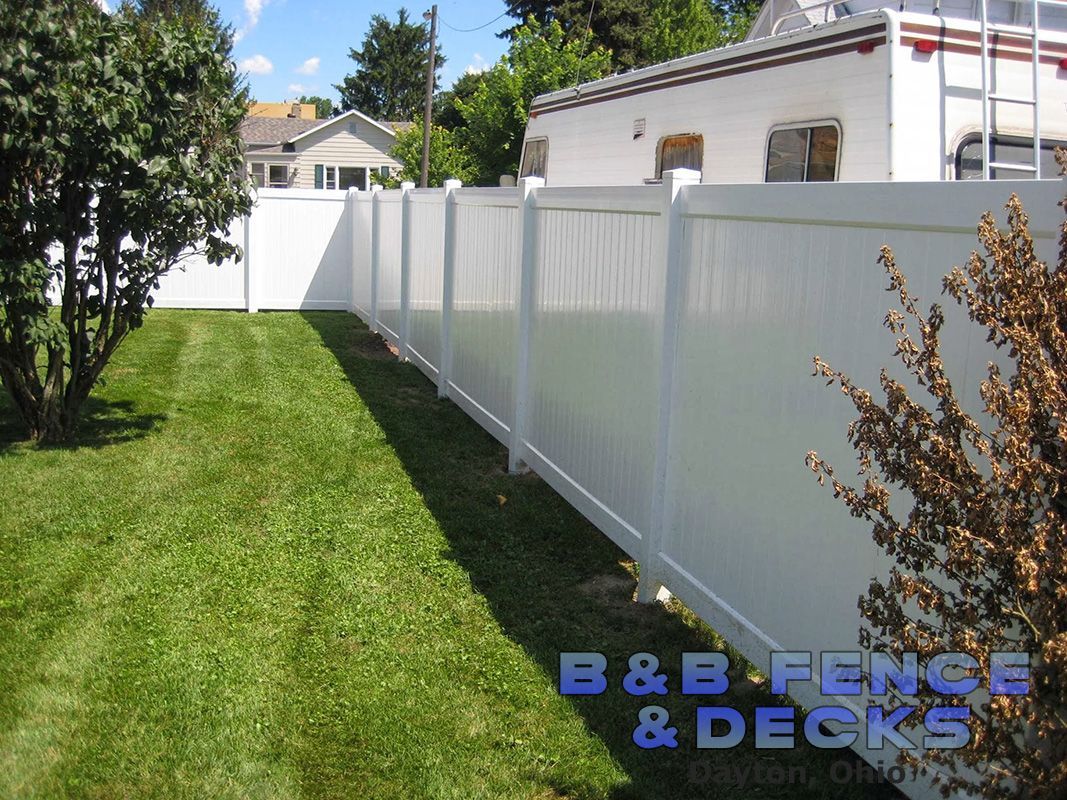 White House With White Vinyl Fence — Dayton, OH — B & B Fence & Decks LLC