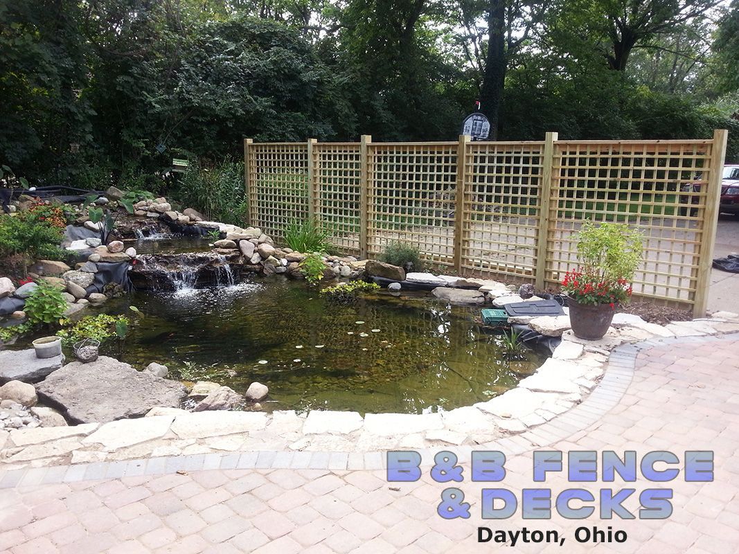 A Pond With Metal Fence — Dayton, OH — B & B Fence & Decks LLC