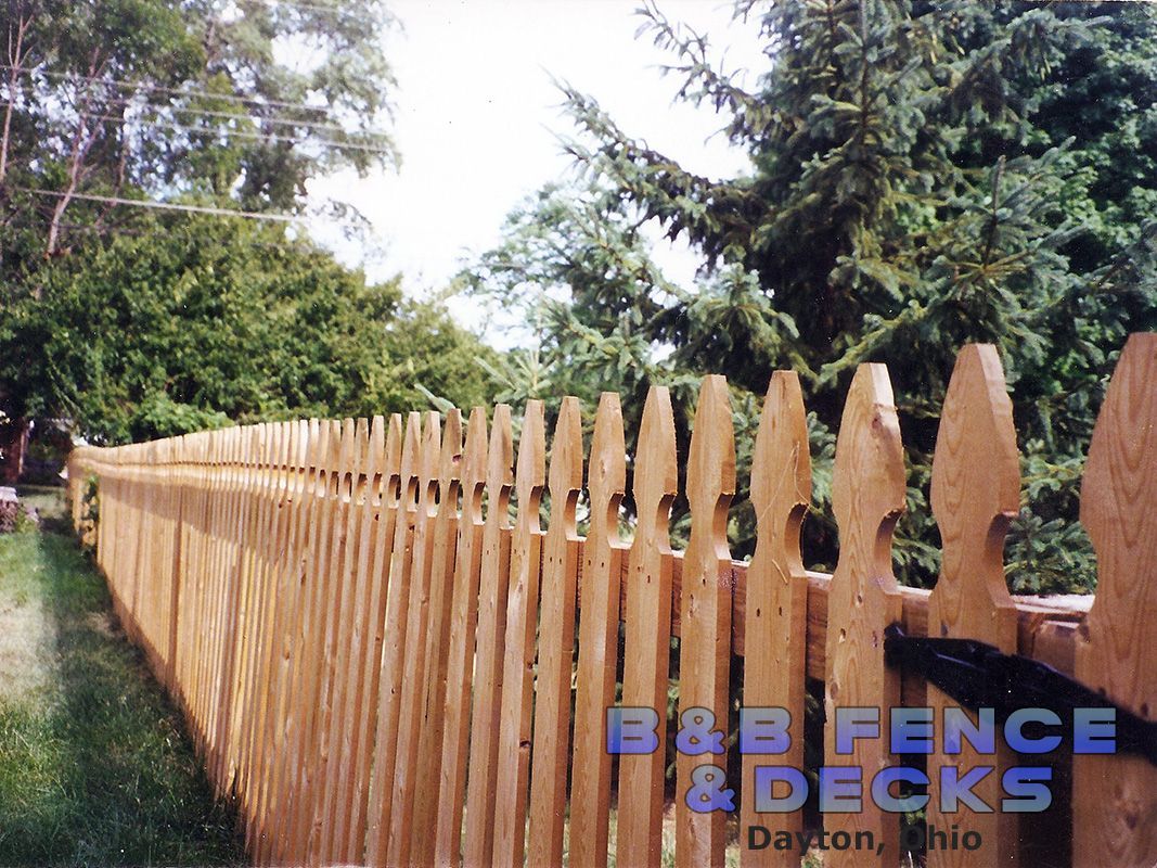 Wooden Picket Fence and Trees — Dayton, OH — B & B Fence & Decks LLC