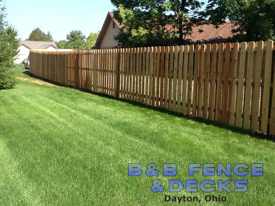 Wide Lawn With Wooden Fence — Dayton, OH — B & B Fence & Decks LLC