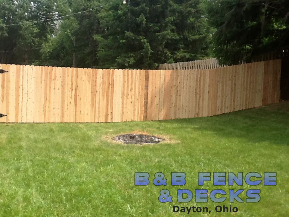Lawn and Wooden Fence — Dayton, OH — B & B Fence & Decks LLC