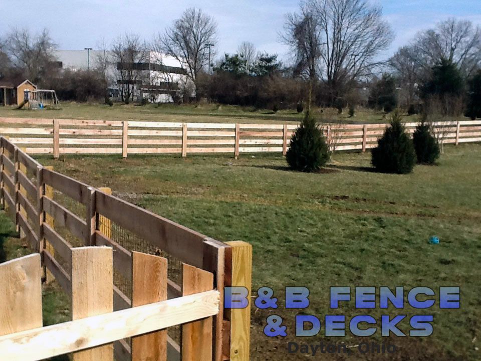 Field With Wooden Fence — Dayton, OH — B & B Fence & Decks LLC