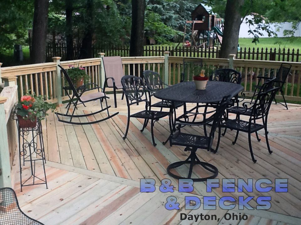 Outdoor Deck With Table and Chair — Dayton, OH — B & B Fence & Decks LLC