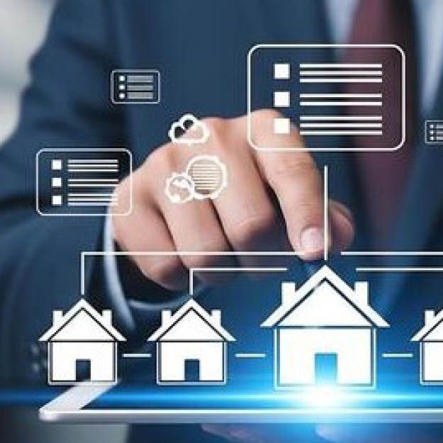 Hand tapping digital house icons, suggesting smart home selection or property management