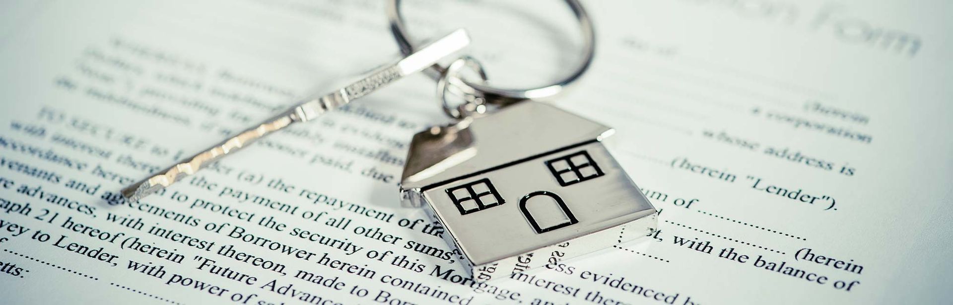 house keychain on document