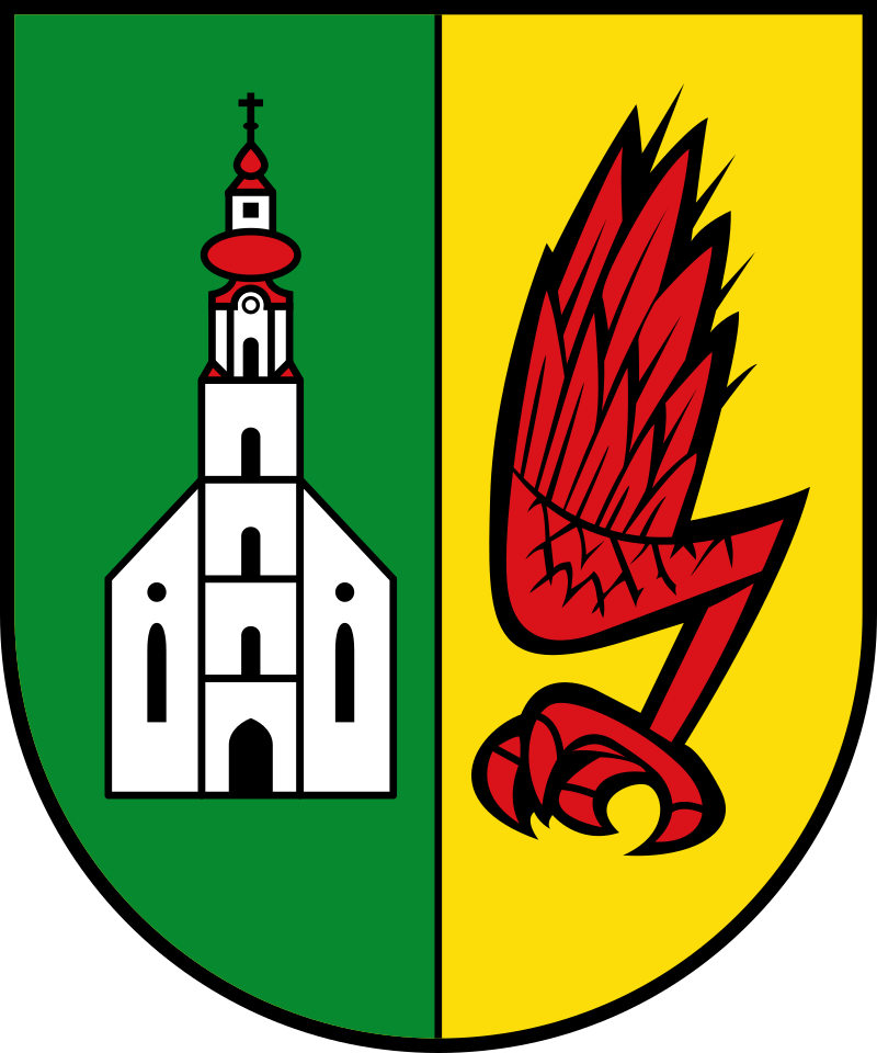 Geteilter grüner und gelber Schild mit einer weißen Kirche auf der linken und einer roten Feder/einem roten Kiel