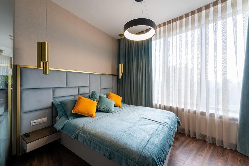 There is a large bed in the middle of the room.
