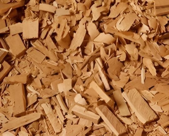 Pile of Light Brown Wood Chips — John's Tree Lopping in Belmont, NSW