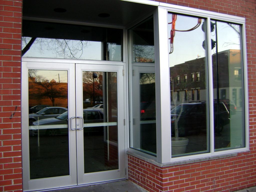 A brick building with a door and a window
