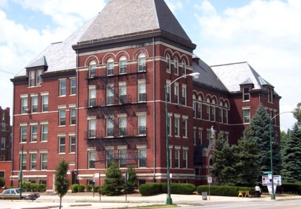 A large brick building with a fire escape on the side