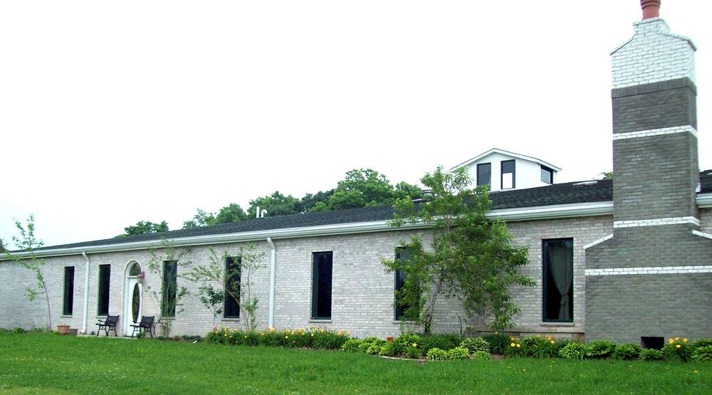 A brick building with a chimney on top of it