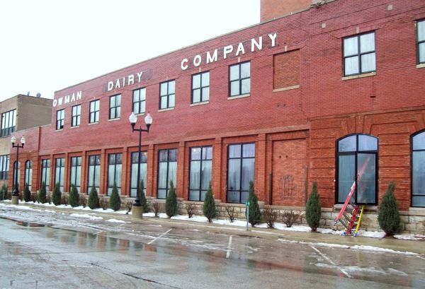 A large brick building that says dairy company on it