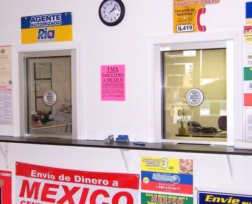 A counter with a sign that says envio de dinero a mexico