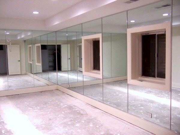 A room with a lot of mirrors on the wall