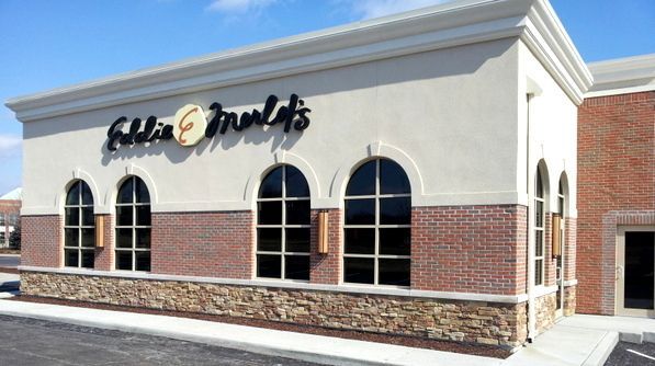 A building with a sign that says ' fallen fruits ' on it