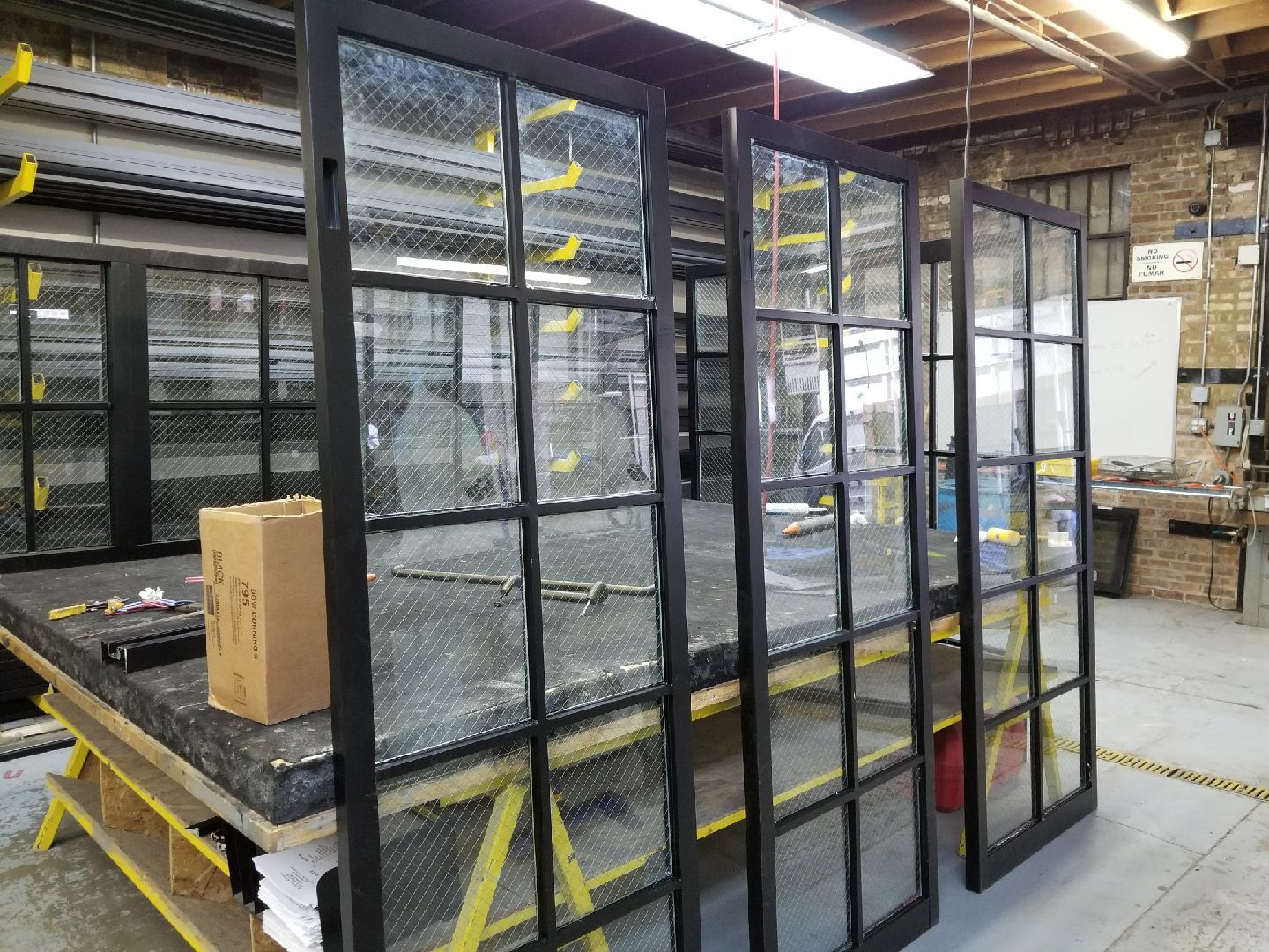 A room with a lot of windows and a box on a table.