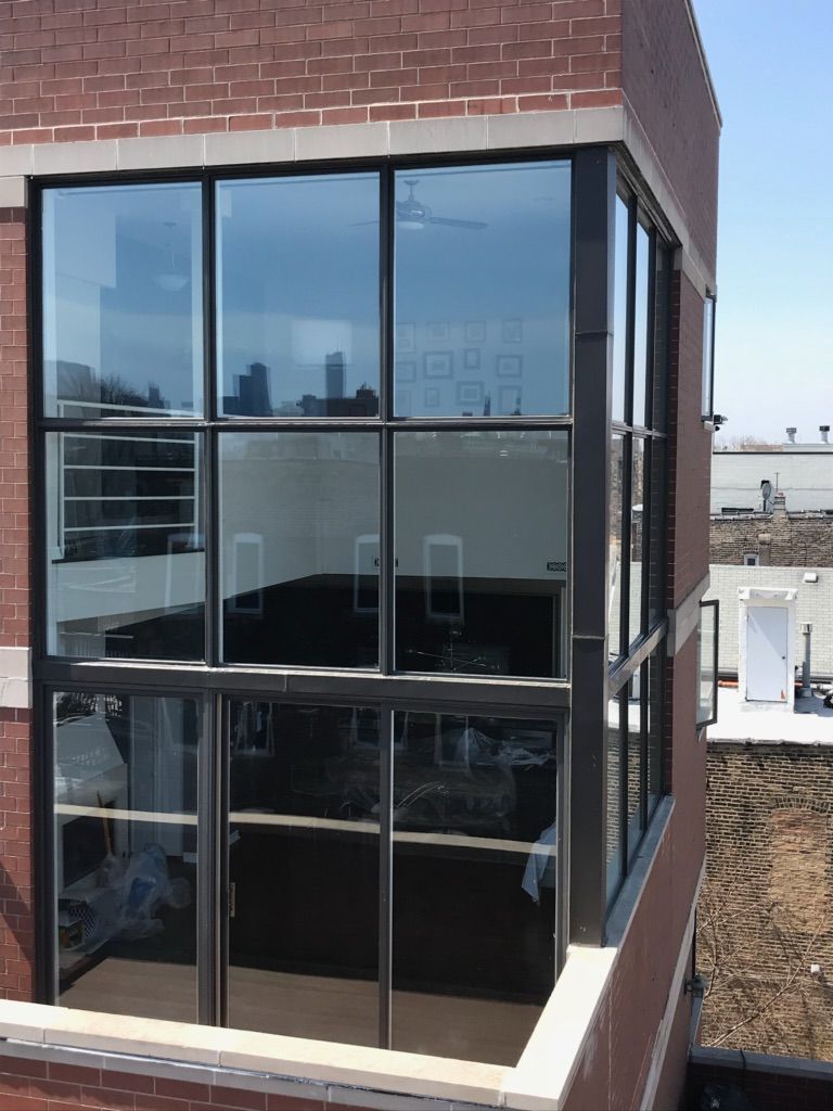 A large window on the side of a brick building