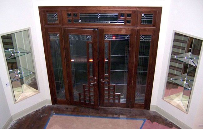 A room with stained glass doors and shelves