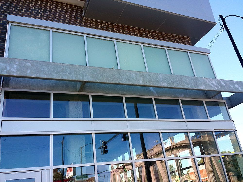 A building with a lot of windows and a canopy