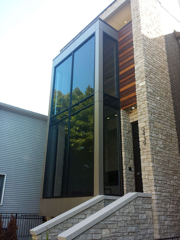 A brick building with a staircase leading up to it