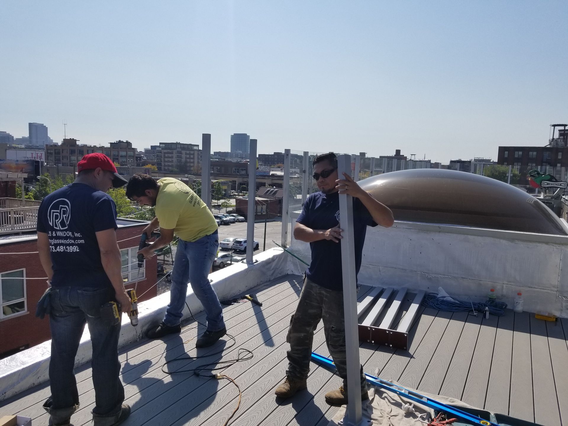 A group of men are working on a roof.