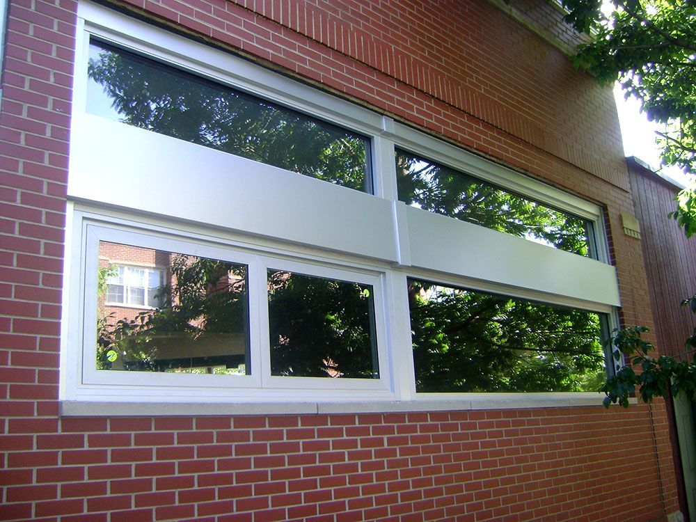A brick building with a large window on the side