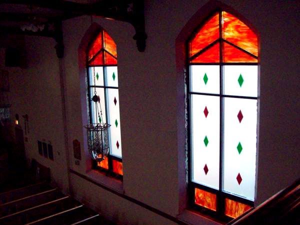 A church with stained glass windows and stairs