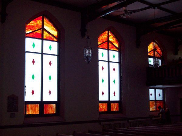The inside of a church with stained glass windows