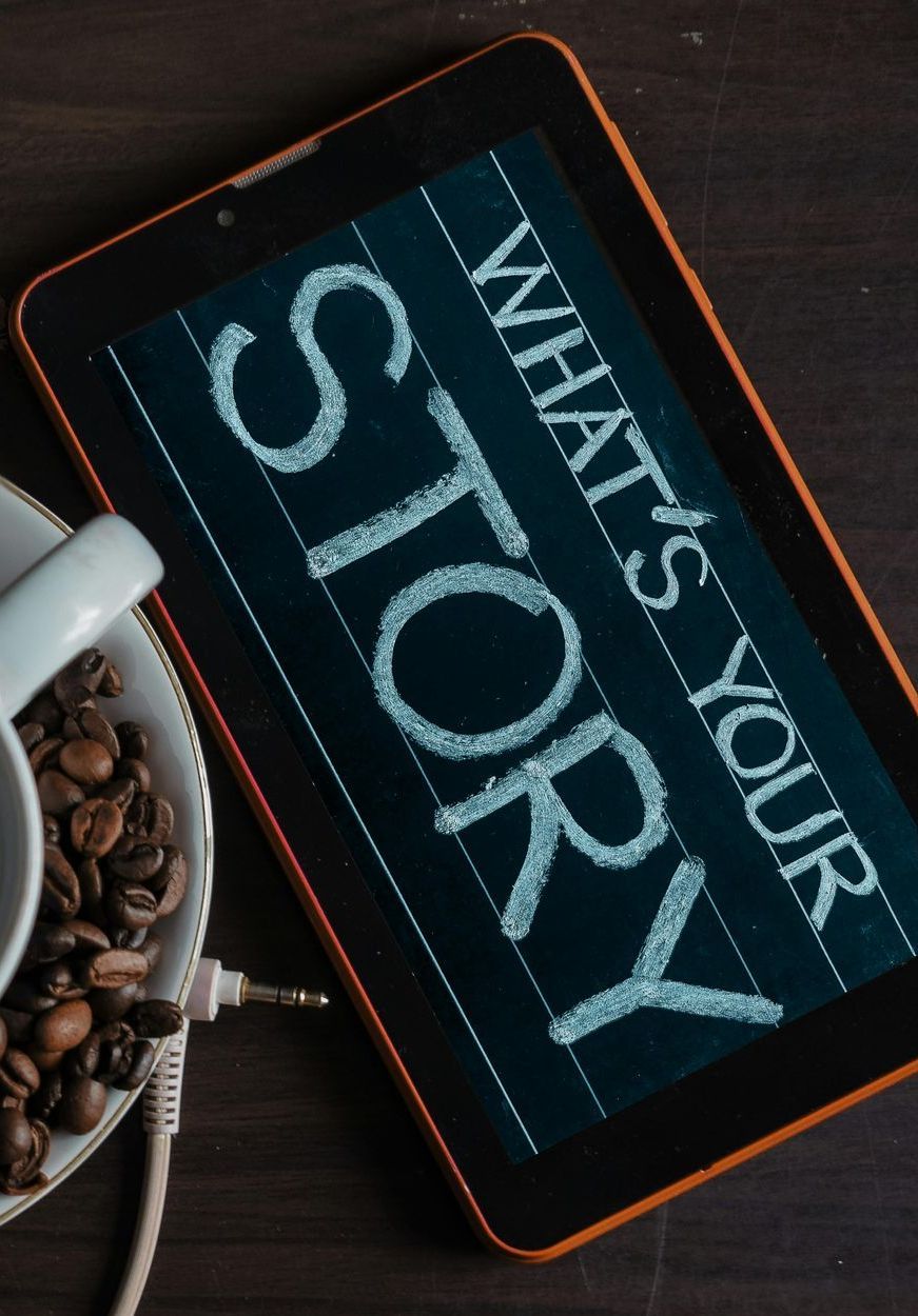 A tablet with the words what 's your story written on it