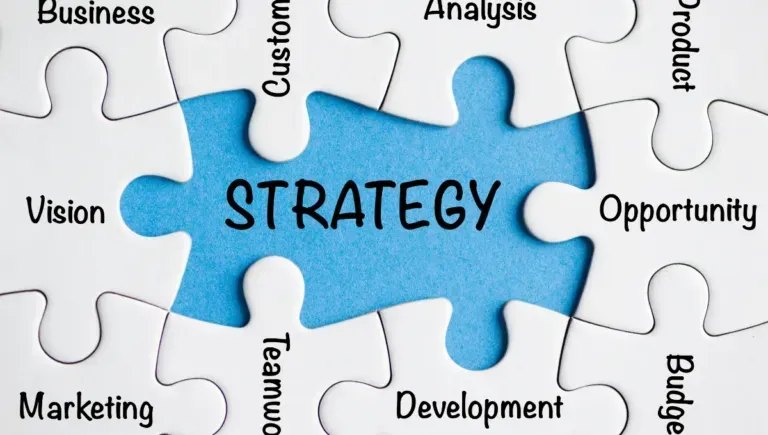 A puzzle piece with the word strategy written on it