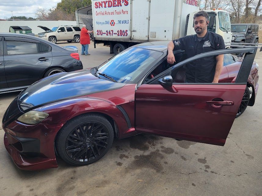 Red Mazda RX-8 parked at Chuck's Garage in Killeen, Texas.
