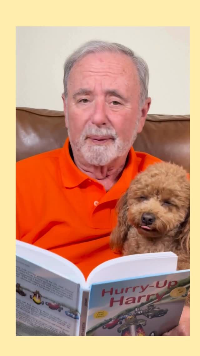 Man reading aloud to a small brown dog; the book title is "Hurry-Up Harry."