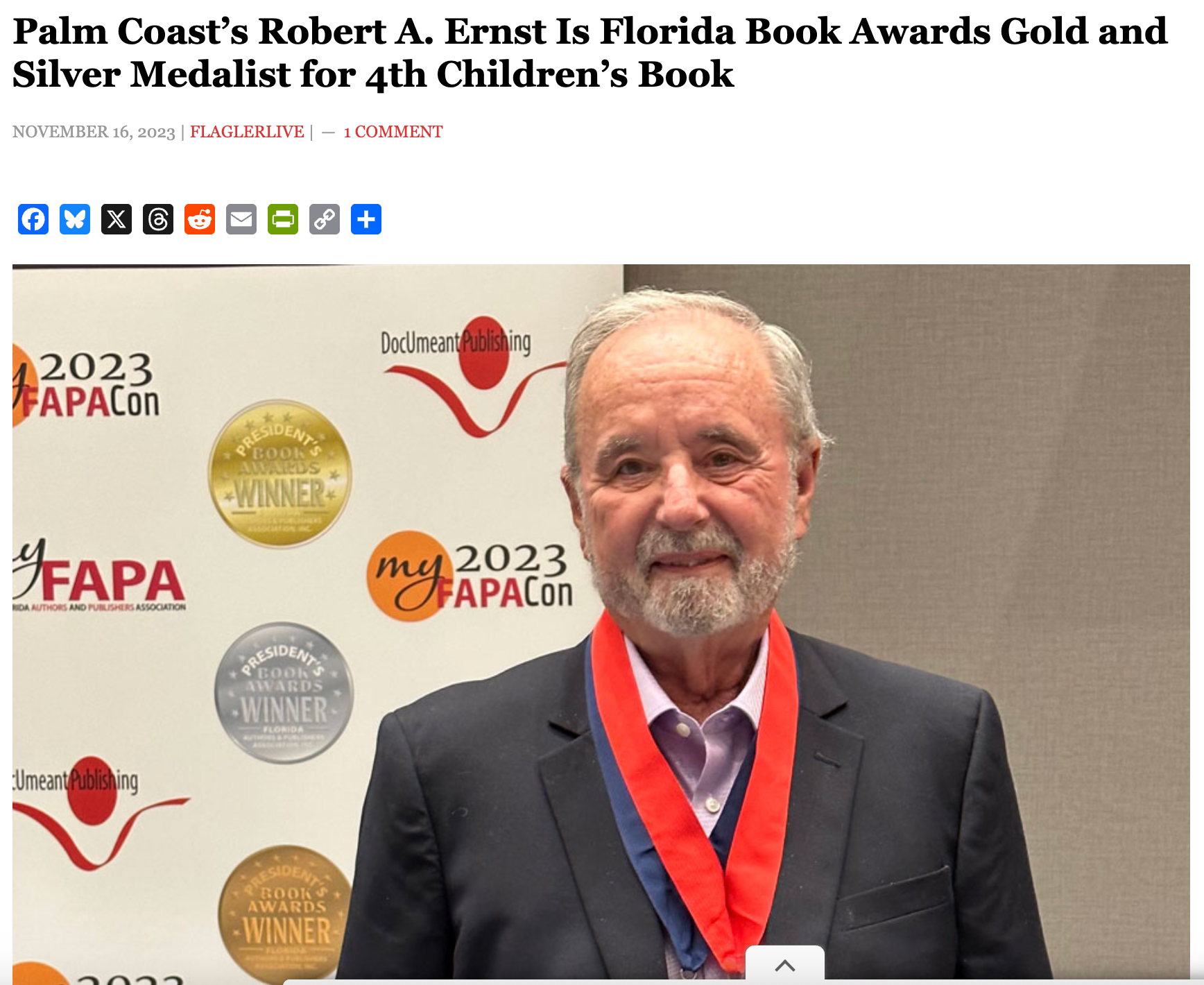 Robert A. Ernst in suit with a medal, at an event. Text mentions Florida Book Awards.