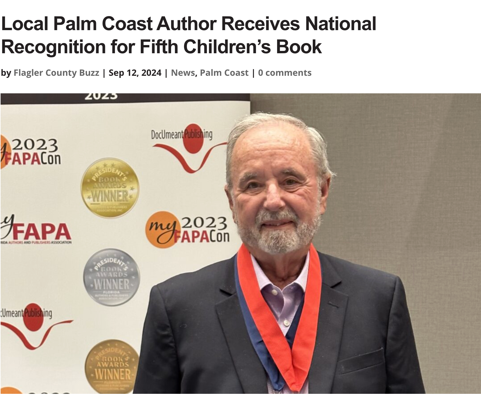 Local author in Palm Coast receives national recognition for his children's book. He is wearing a medal.