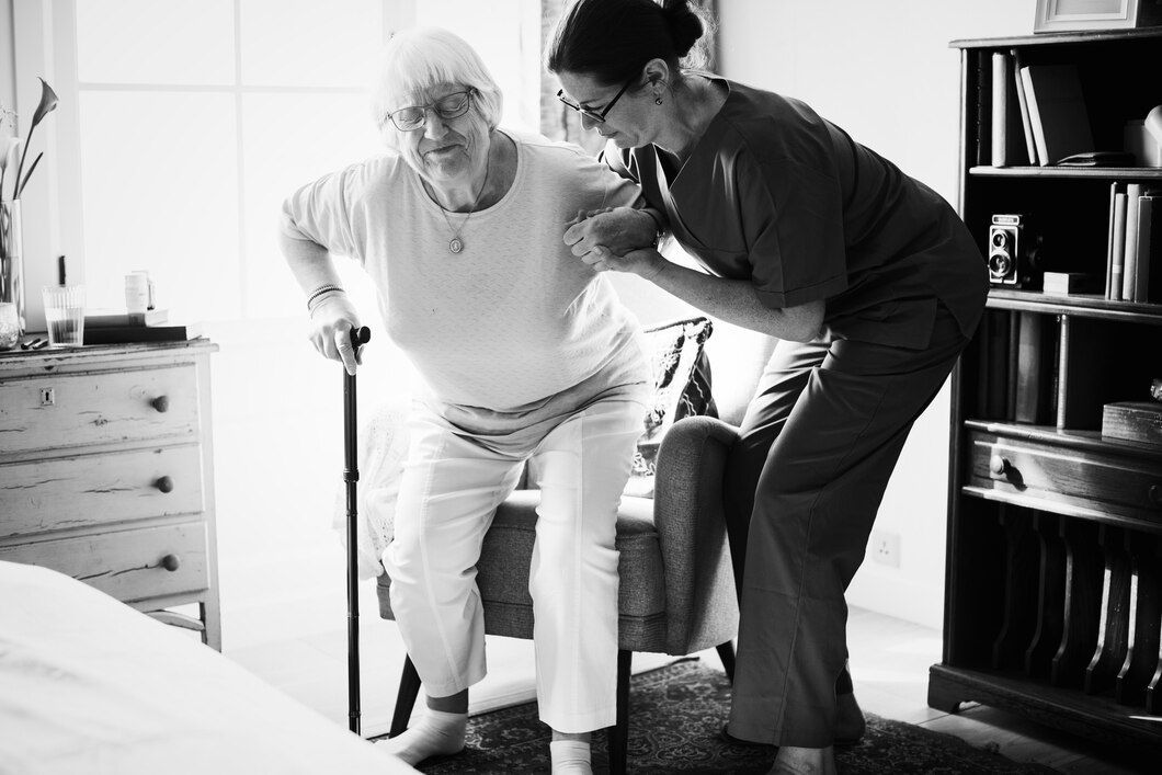 nurse-helping-senior-woman-stand