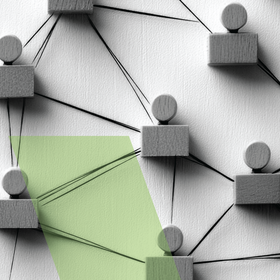 Abstract network of gray blocks and spheres connected by lines, with a light green highlighted area.