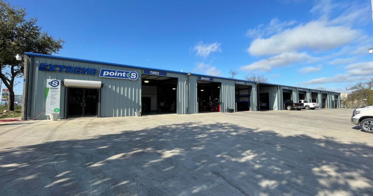 A grey metal commercial building featuring 