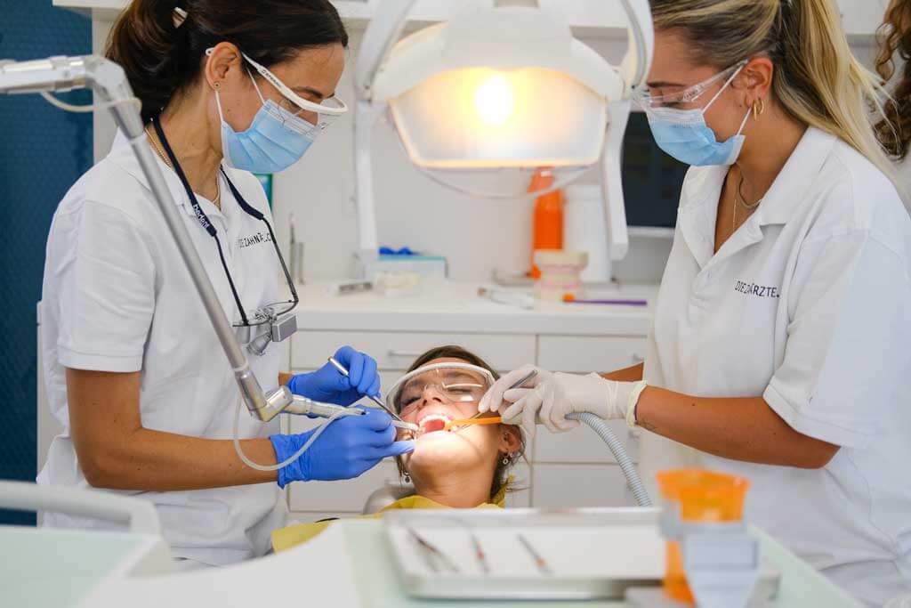 Dentists treating a patient