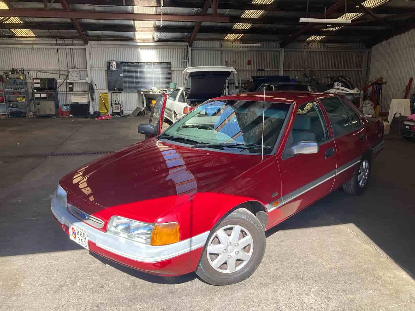 A Red Car Is Parked In A Garage — NEID Automotive In North Gosford, NSW