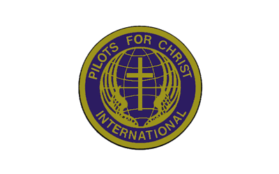 Pilots For Christ International circular logo in purple and gold with a cross and globe