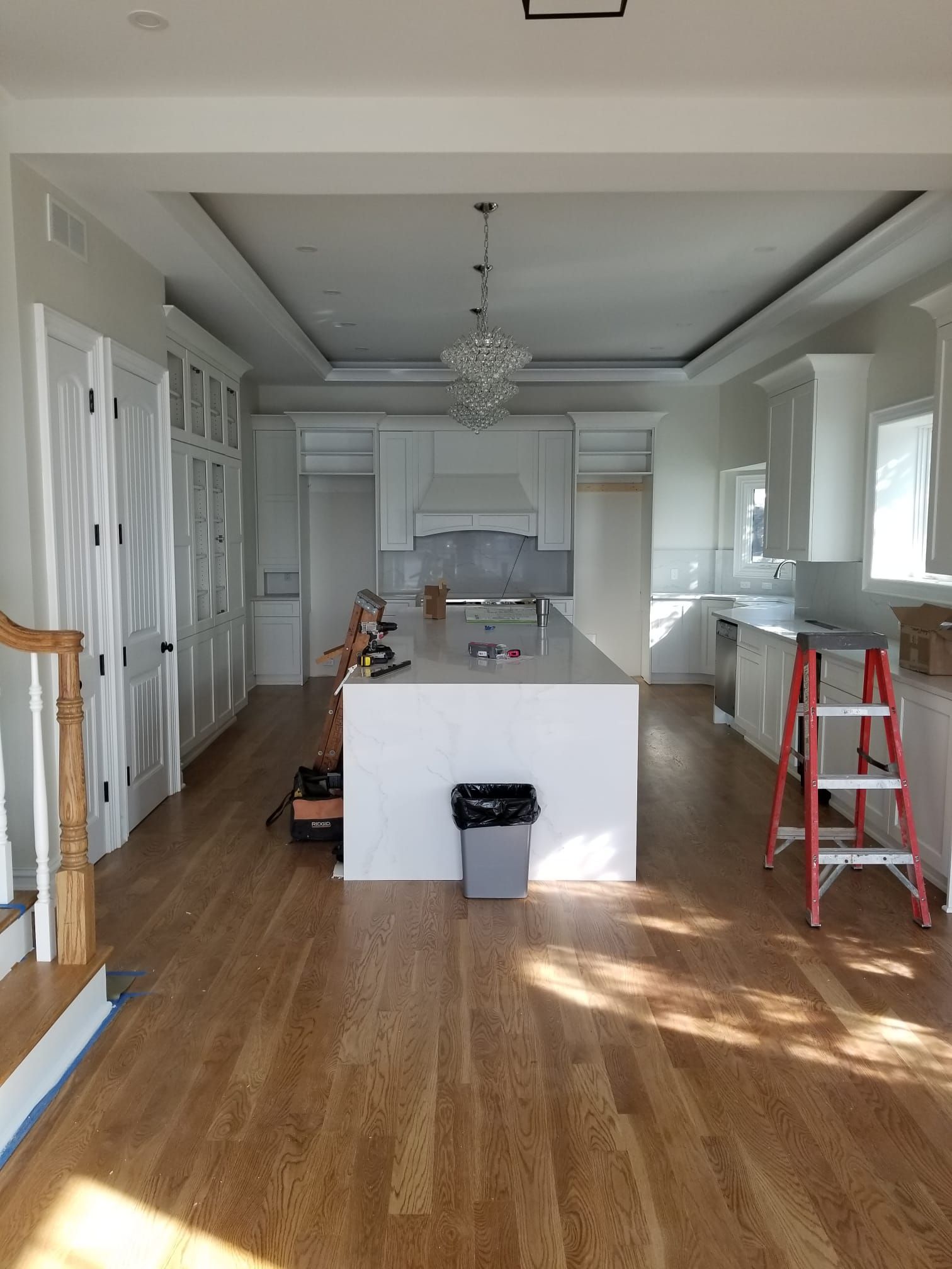A kitchen with a large island in the middle of the room.