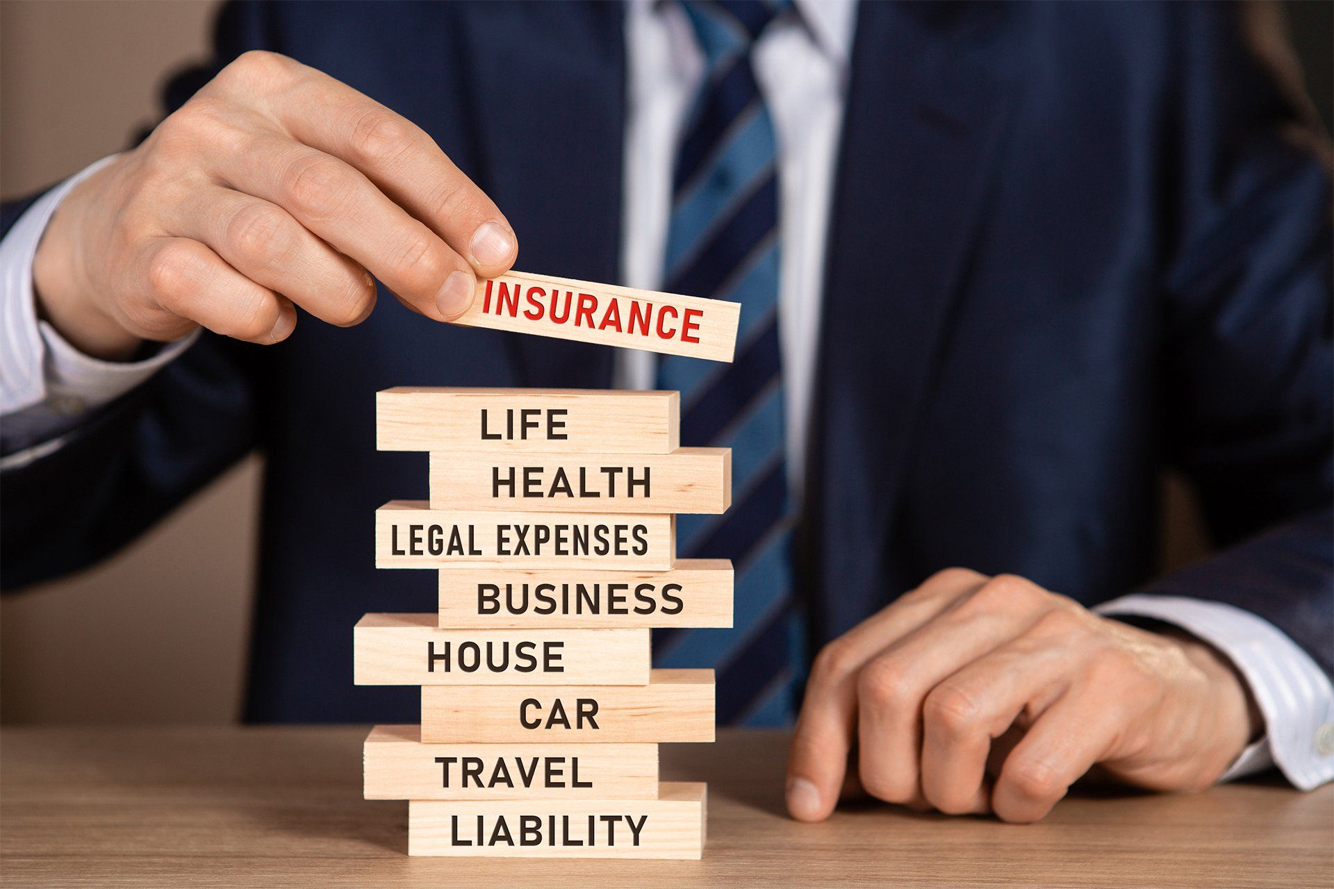 Stacking Wood Blocks With Words About Insurance — Umatilla, FL — Olson Insurance