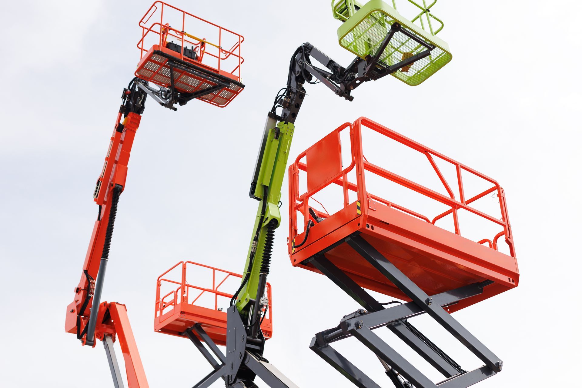 Orange and green boom lifts and equipment rental