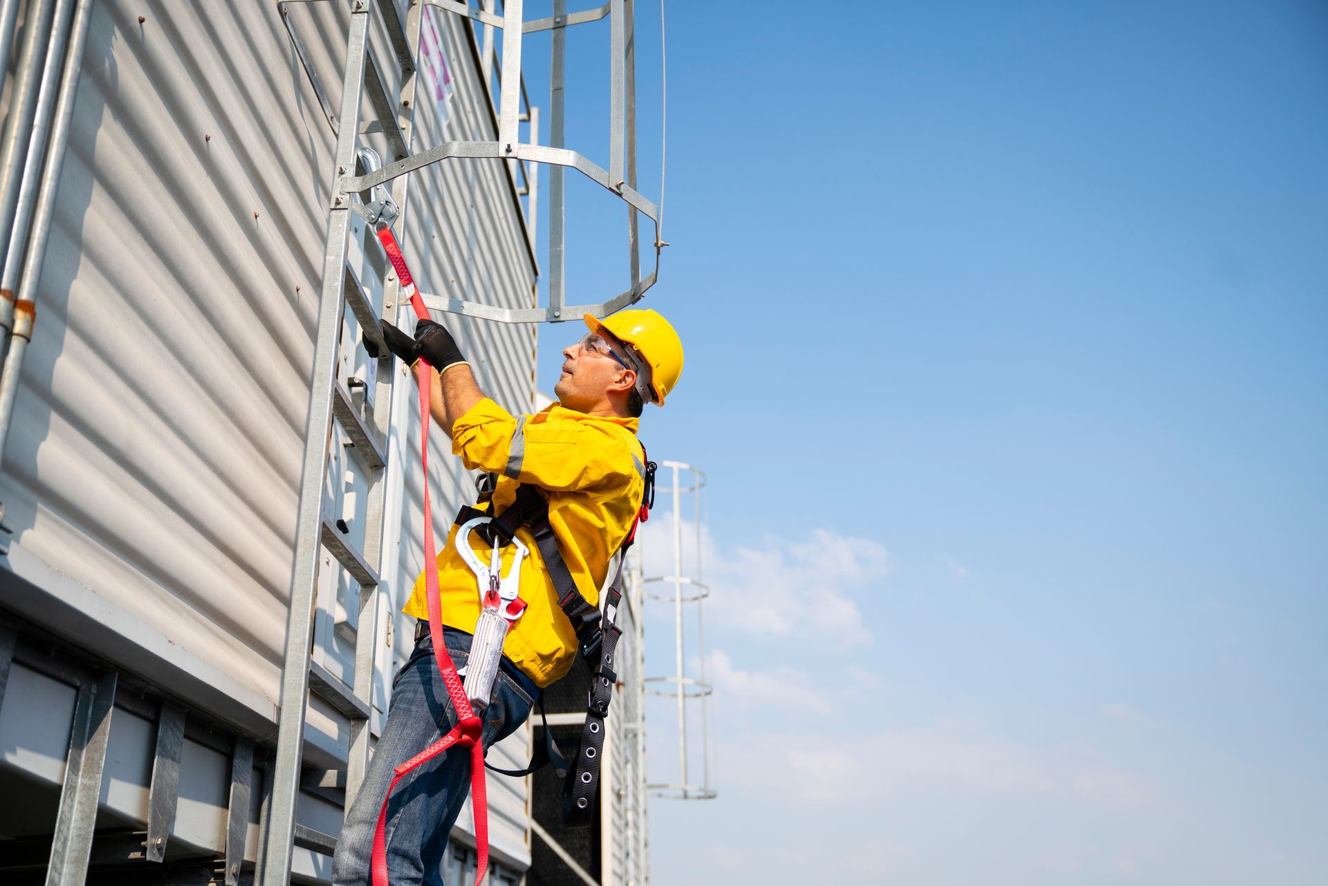 Construction worker wearing safety harness and safety line working at high place. Construction worker wearing safety harness and safety line working at high place.