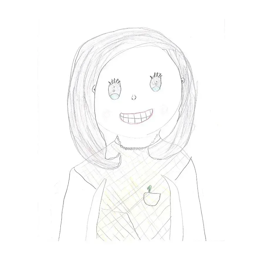 Smiling person with shoulder-length hair, wearing a jacket and sweater, with a pocket and pin on the sweater.