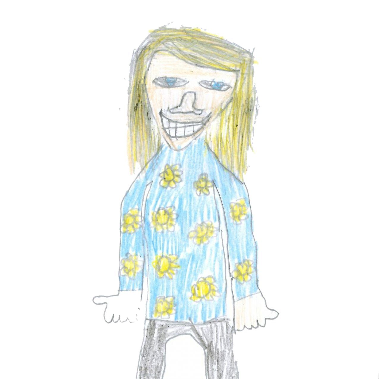 Person with blonde hair smiles widely, wearing a blue shirt with yellow flowers and black pants.