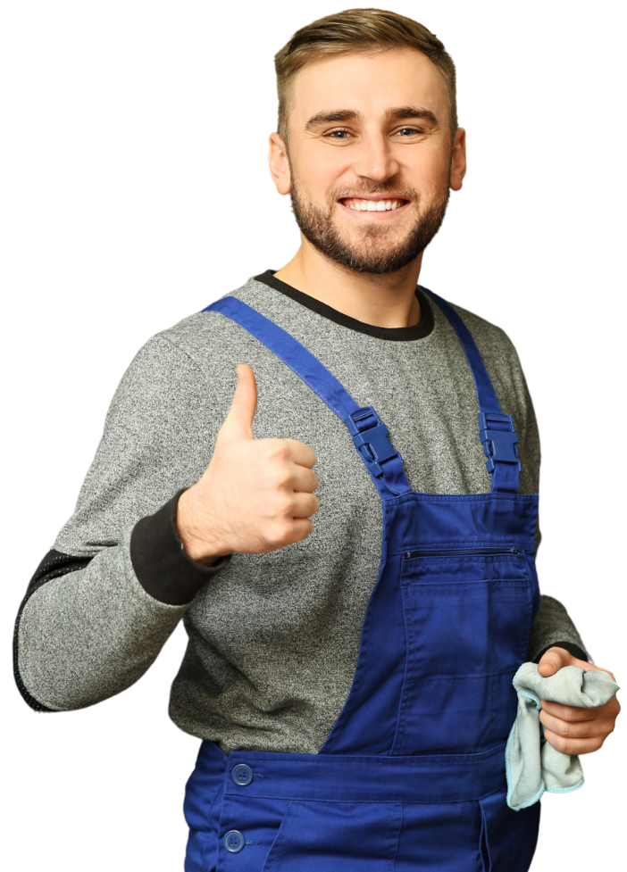 A man smiling, holding a rag, and giving a thumbs up