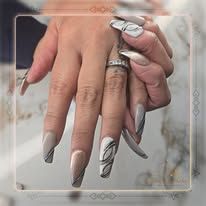 Hands with long silver and marble-patterned stiletto nails overlapping on a soft neutral background.
